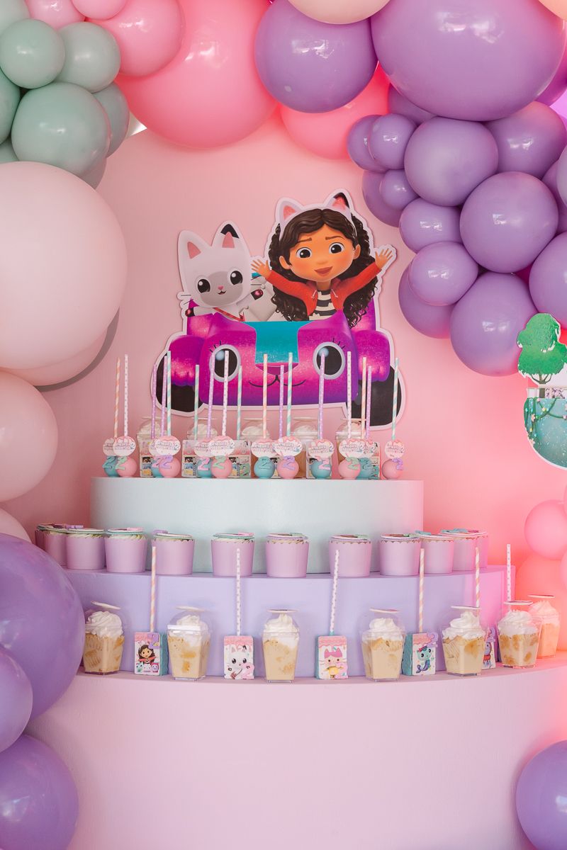 Towering dessert display with themed treats, perfectly styled for a Gaby’s Dollhouse birthday party in NYC.