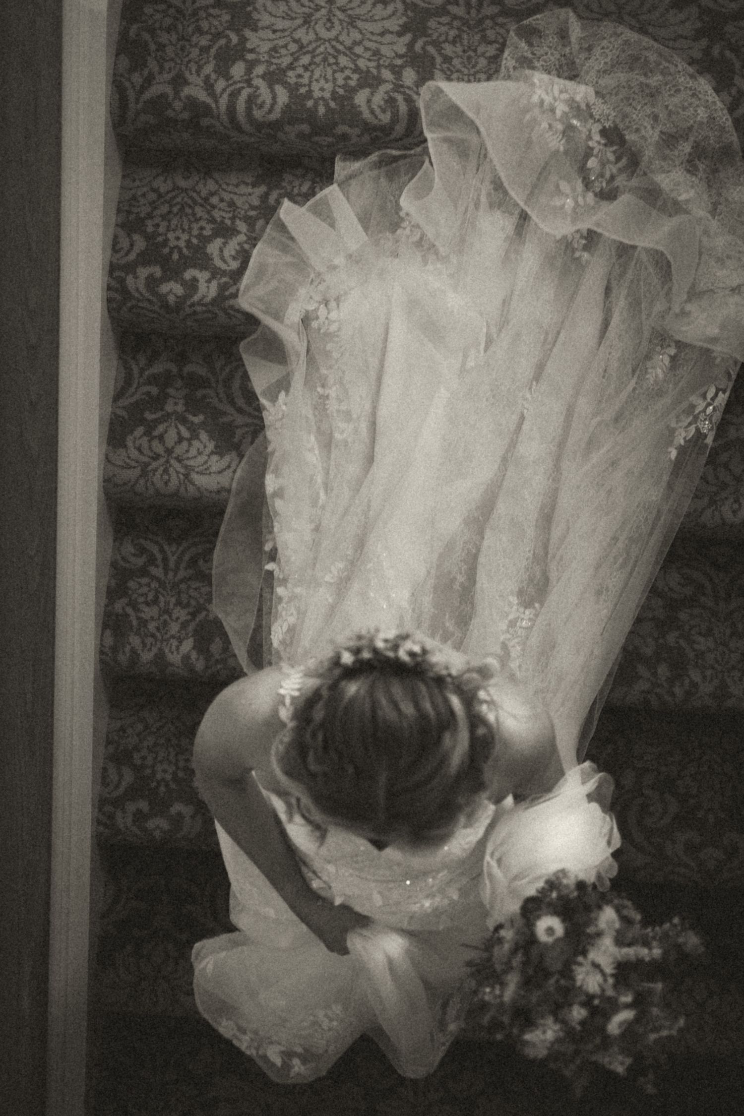 Black & White image of Bride on the way to the ceremony at her wedding at Lindeth Howe in Windermere, Lake District