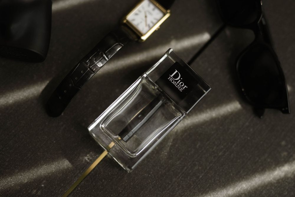 groom flat lay photo of dior cologne at Primrose Hill farm Wedding- Photo by Primrose Hill Farm Wedding Photographer, Olivia J Morgan Photog