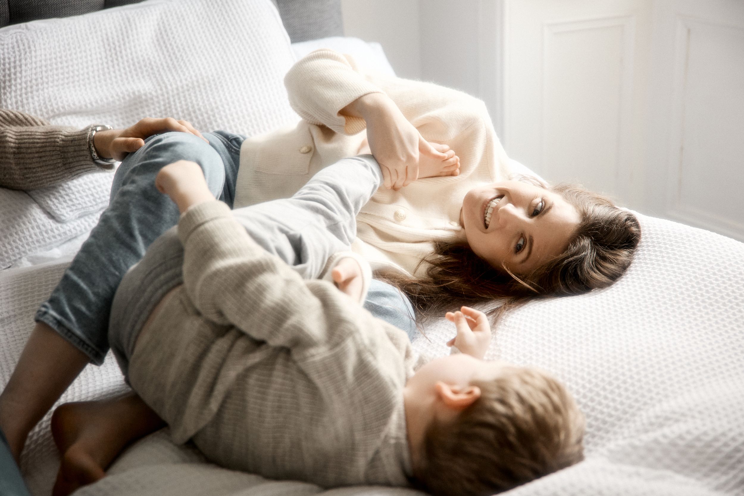 mom with son on the bed home photoshoot