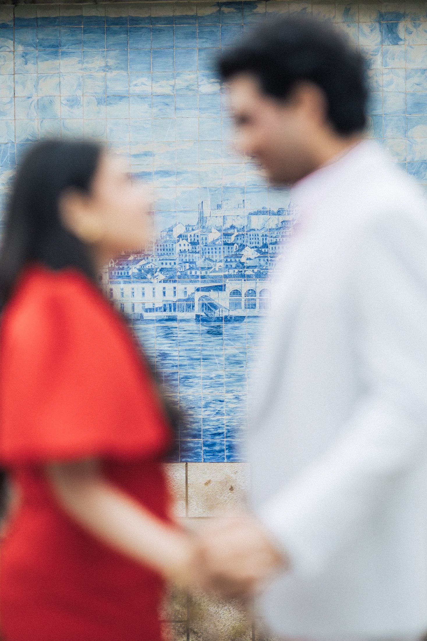 Indian couple walking through the streets of Baixa, Lisbon during their engagement session.