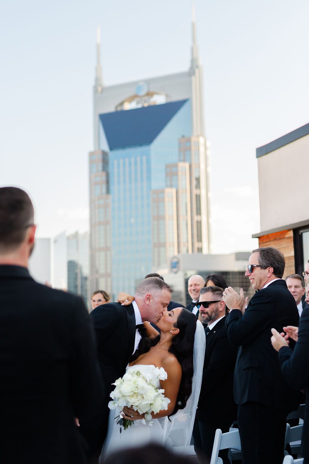 A wedding ceremony takes place in downtown Nashville with the iconic AT&T Building in the background. Top 10 Nashville Wedding Venues and Ho