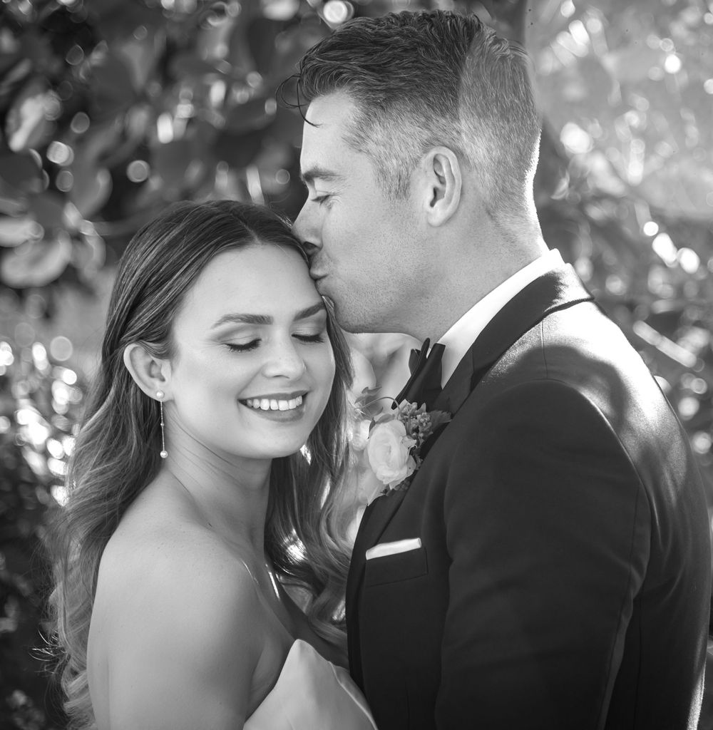 Couple dancing alone under stars at The Ray Hotel rooftop, by luxury wedding photographers in Florida