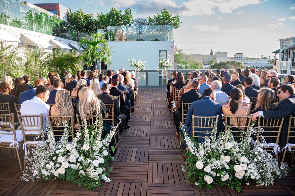 Editorial-style couple’s portrait on balcony at The Ray Hotel by destination wedding photographers in Florida
