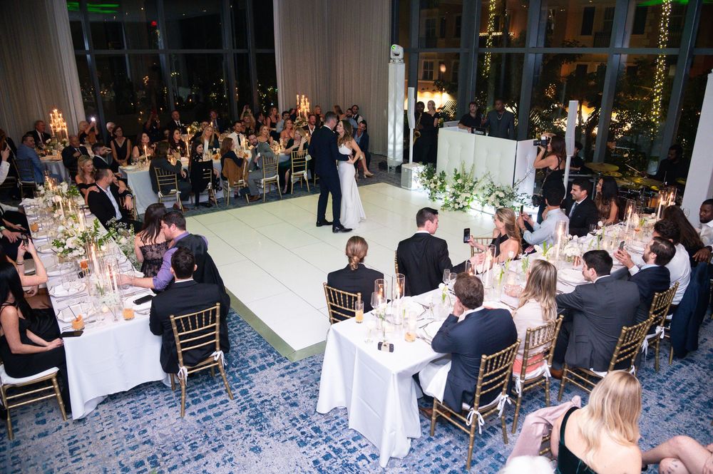 Bride and groom exit ceremony with joyful expressions, documented by luxury wedding photographers in Florida