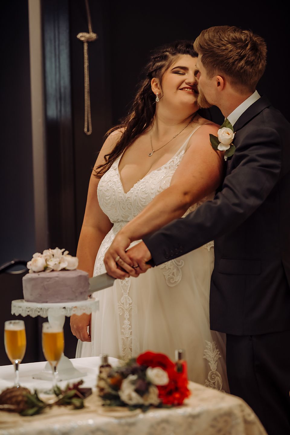 A sequence of intimate wedding reception moments showing the couple's romantic interaction at a table with drinks and decor.