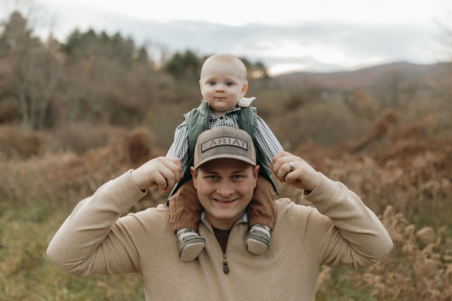 Playful outdoor moment captured against autumn mountain landscape during golden hour.