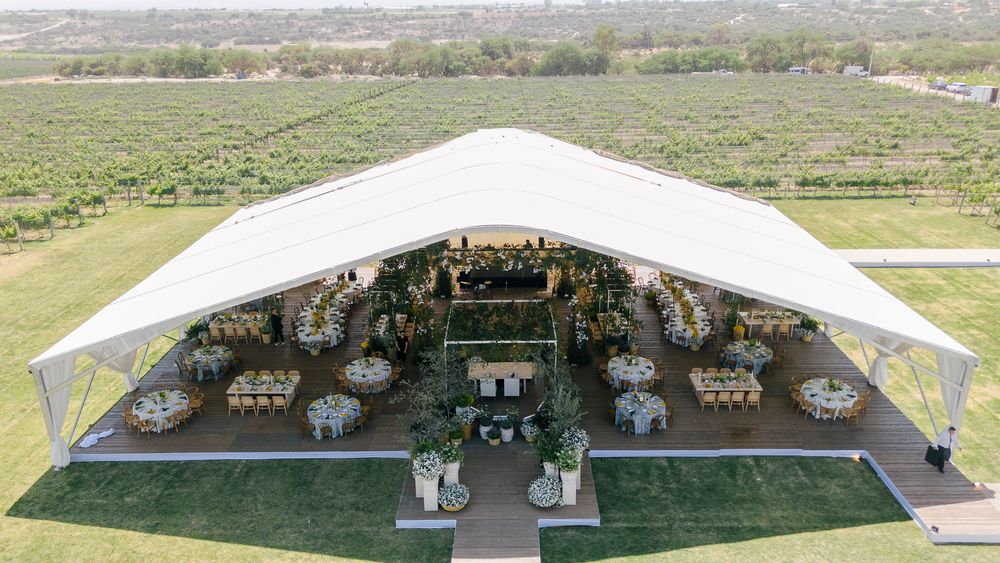 A series of panoramic views showing an elegant outdoor wedding venue setup with white canopy and scenic landscape.
