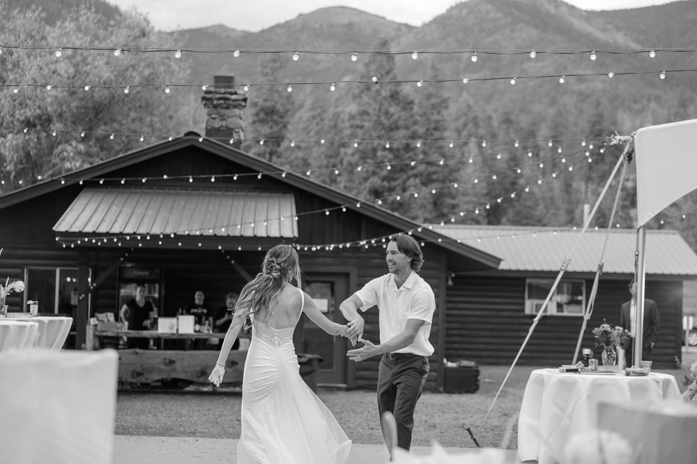 A panoramic black and white photo sequence showing people at an outdoor tennis court with mountains in the background.