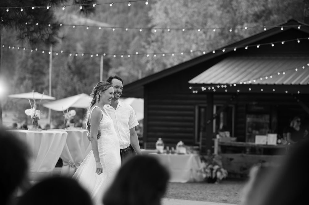 Black and white wedding photos displayed in sequence showing dance floor moments under string lights at an outdoor reception.
