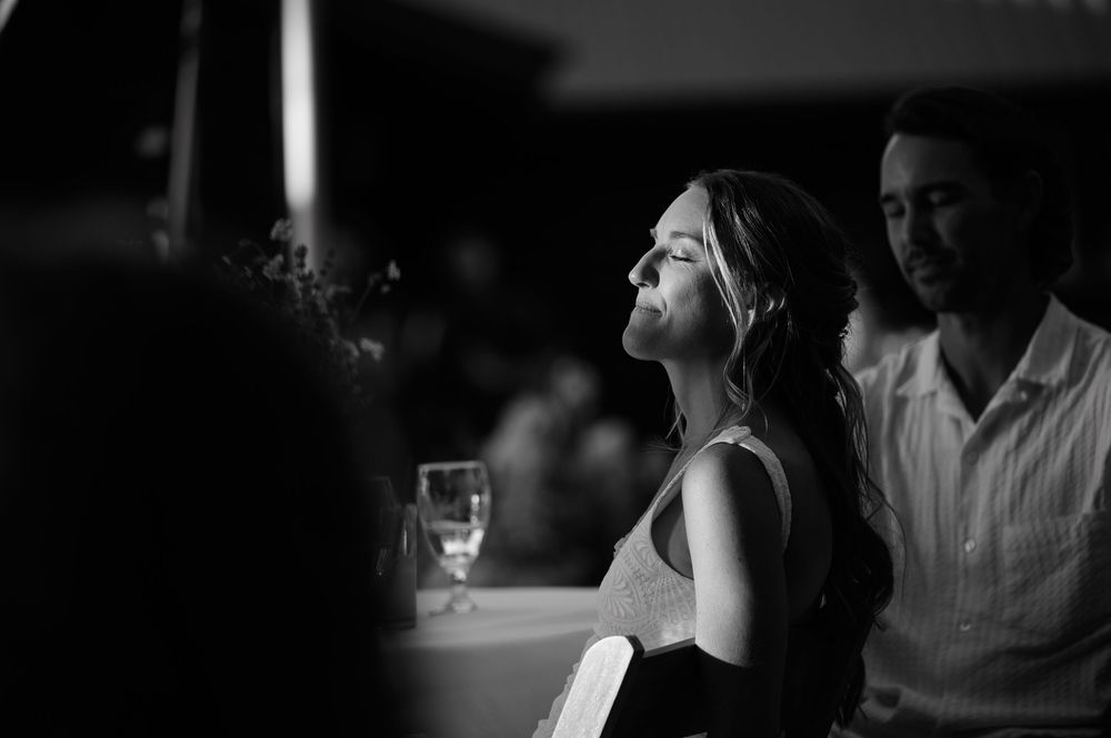 A collage of intimate wedding moments showing couples and hands during a romantic celebration at night.