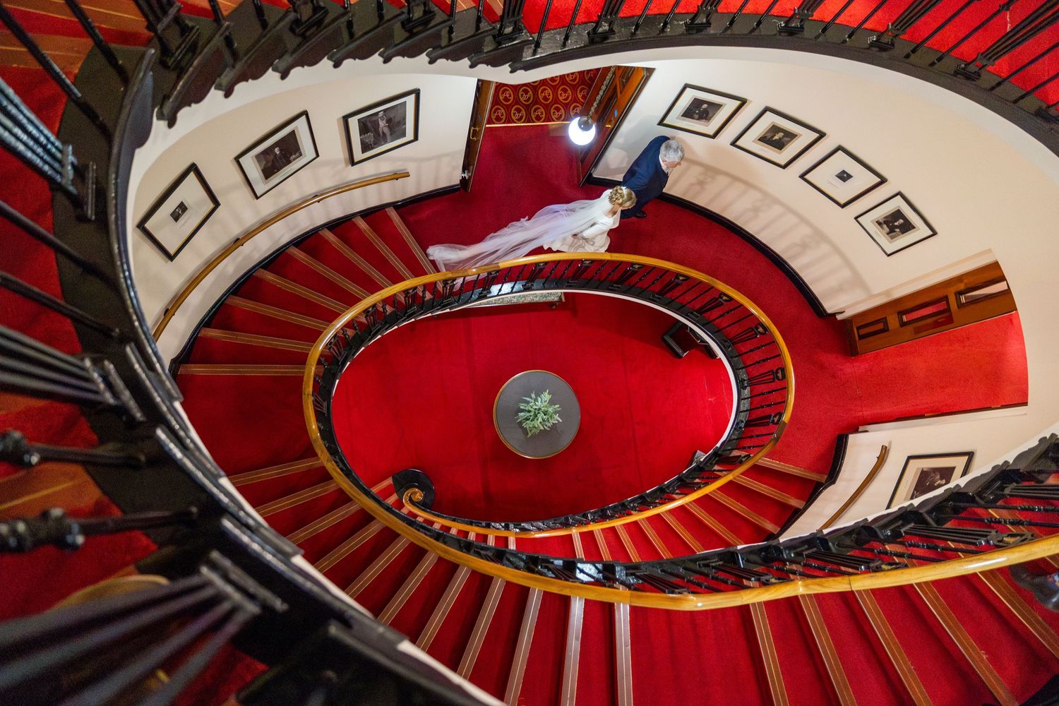 the large sweeping staircase backdrop great for natural couple portraits at the Atheneum Liverpool City Centre by Stuart Morris Photography