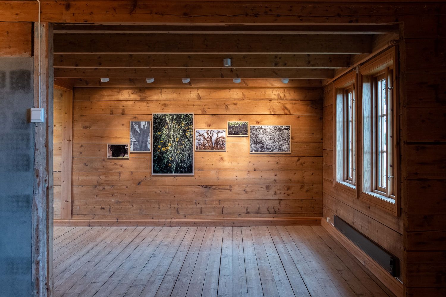 Six oak-framed prints on raw wooden walls at Klepp kunstforening, Oct 2021, part of a larger solo exhibition.