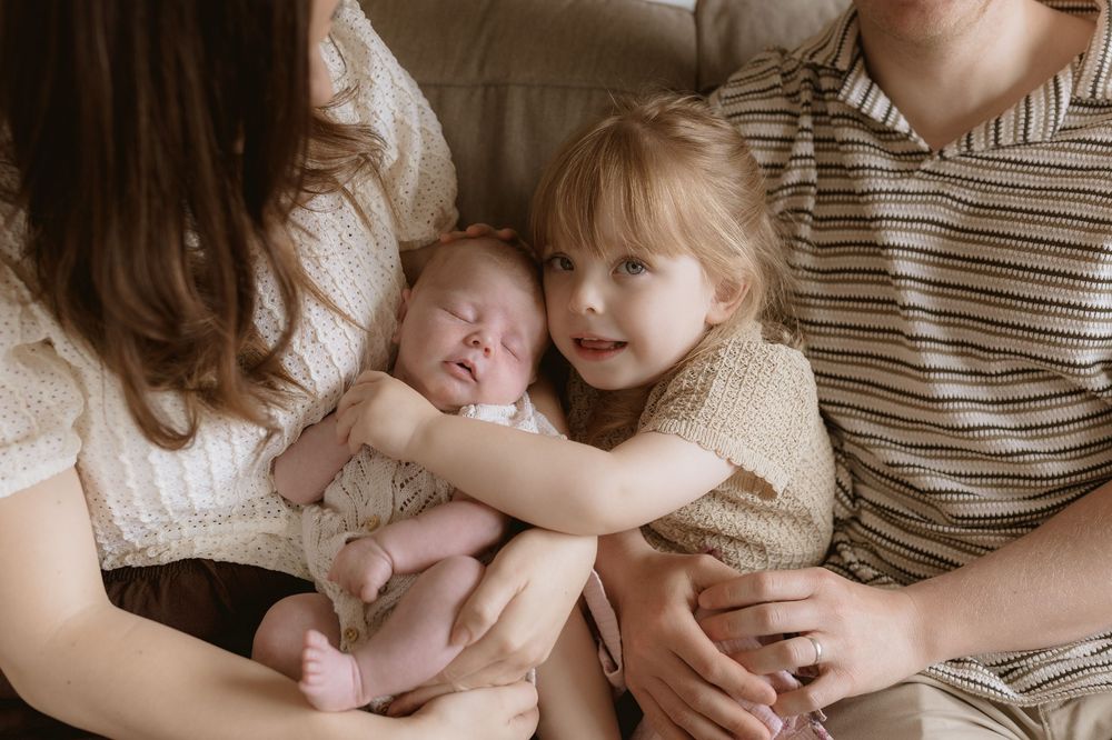 A collection of intimate family portraits showing tender moments between parents and young children in warm, natural lighting.