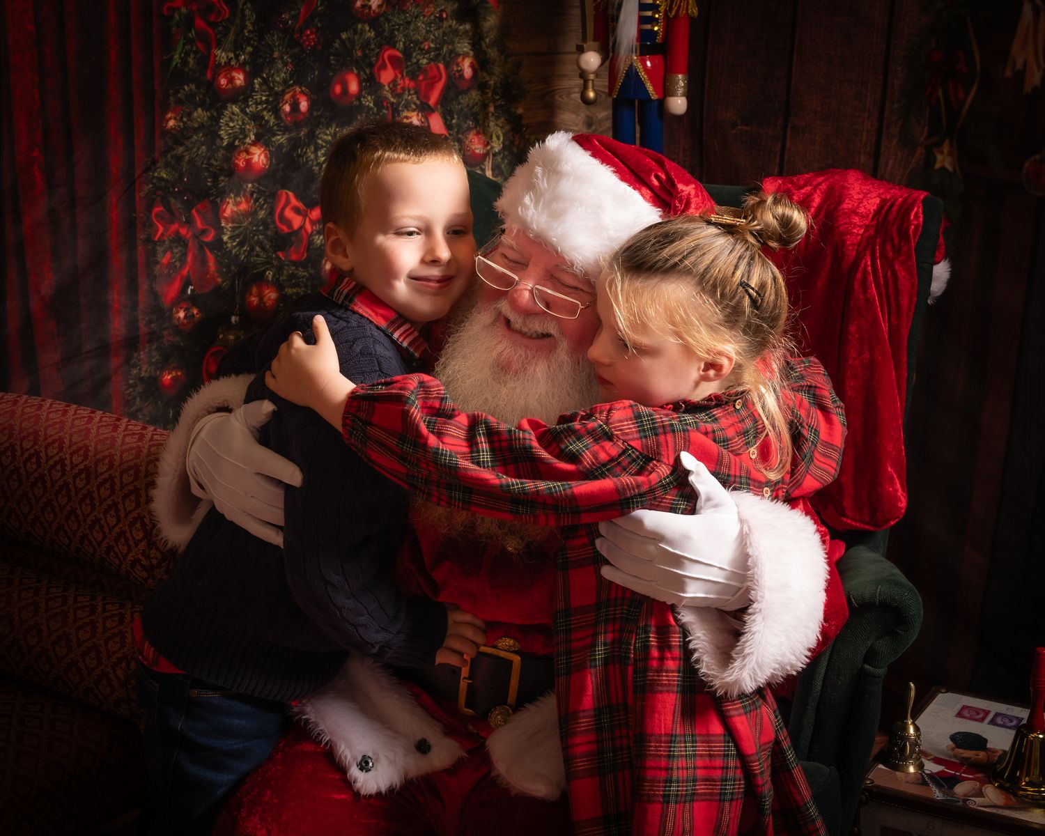 A heartwarming Christmas scene with Santa Claus in his traditional red suit by a decorated tree.