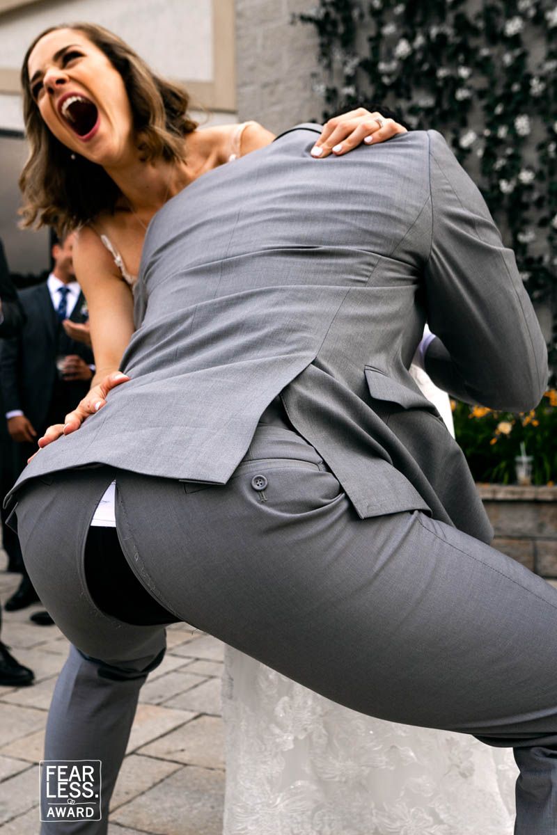 Candid moment captured during a joyful celebration outdoors.