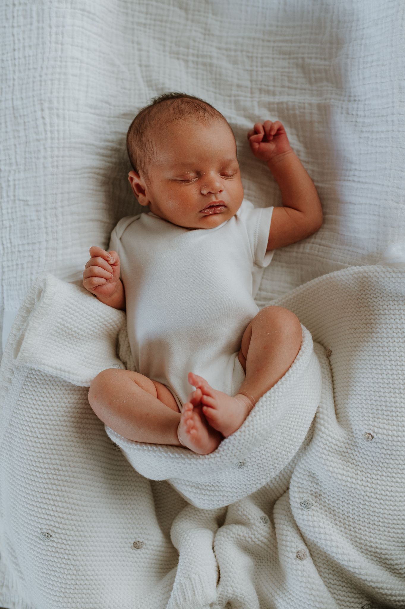 newborn baby in mums arms