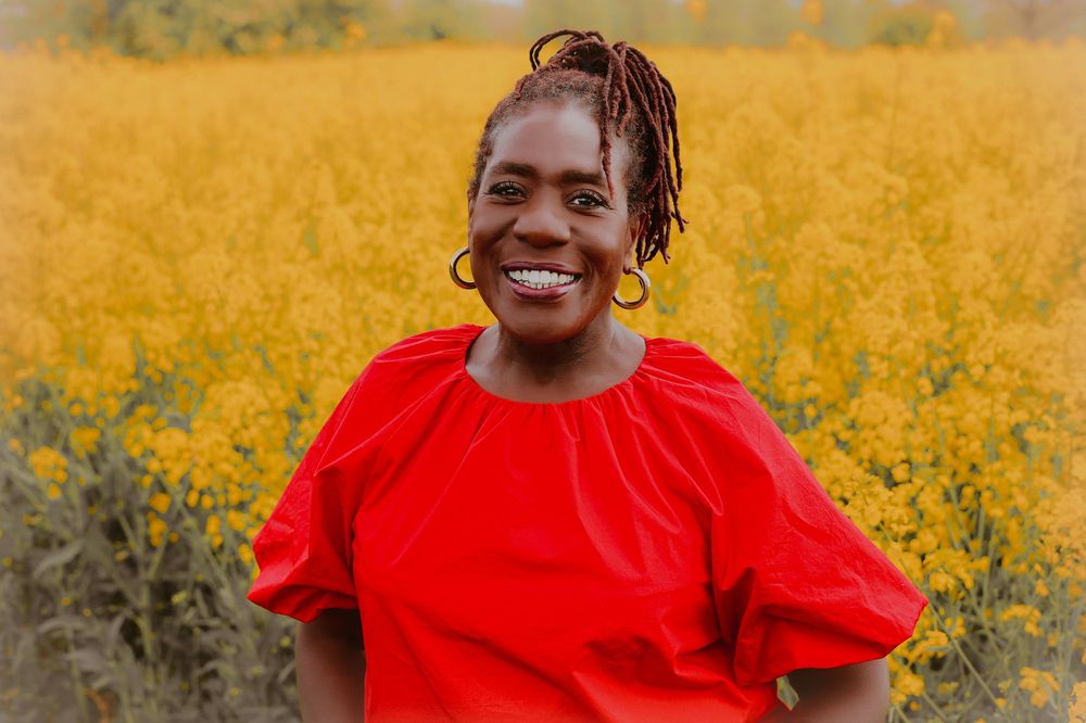 Personal branding, norfolk, flower field, natural light, vibrant, beautiful black woman smiling