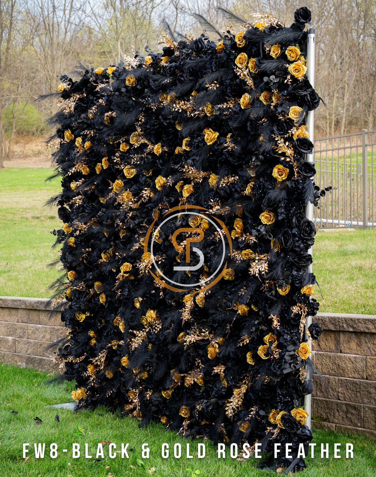 Luxurious black and gold rose feather wall display with circular emblem centerpiece.