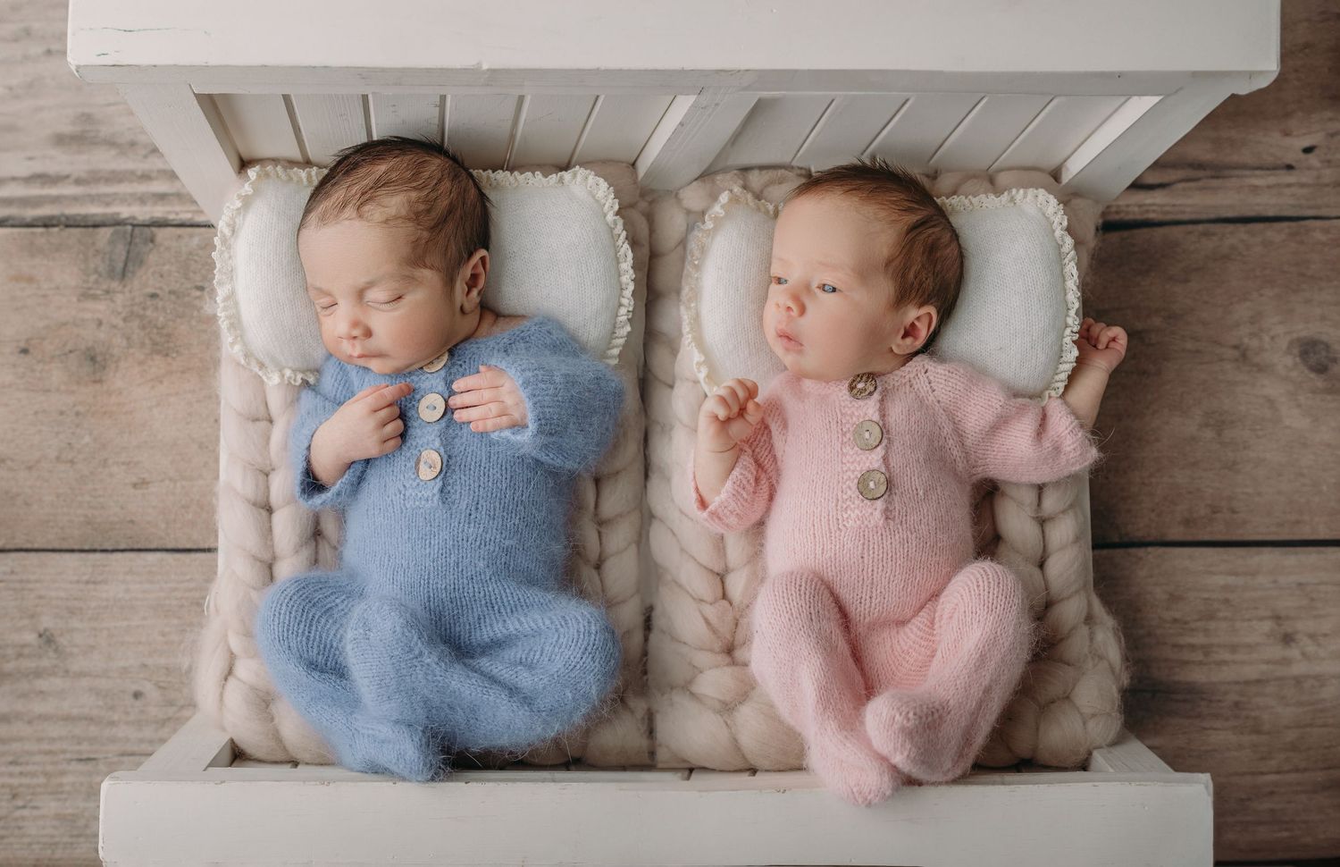 newborn twin photoshoot with babies in prop