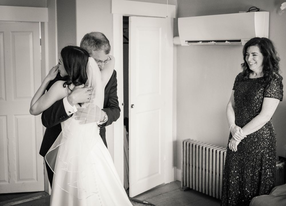 Black and white sequence showing preparation moments in a sunlit room with white doors and radiator.