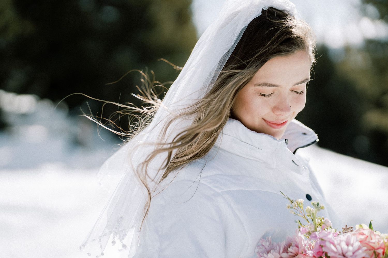 A delicate bridal portrait series in soft natural light features flowing white dress and pastel pink bouquet details.