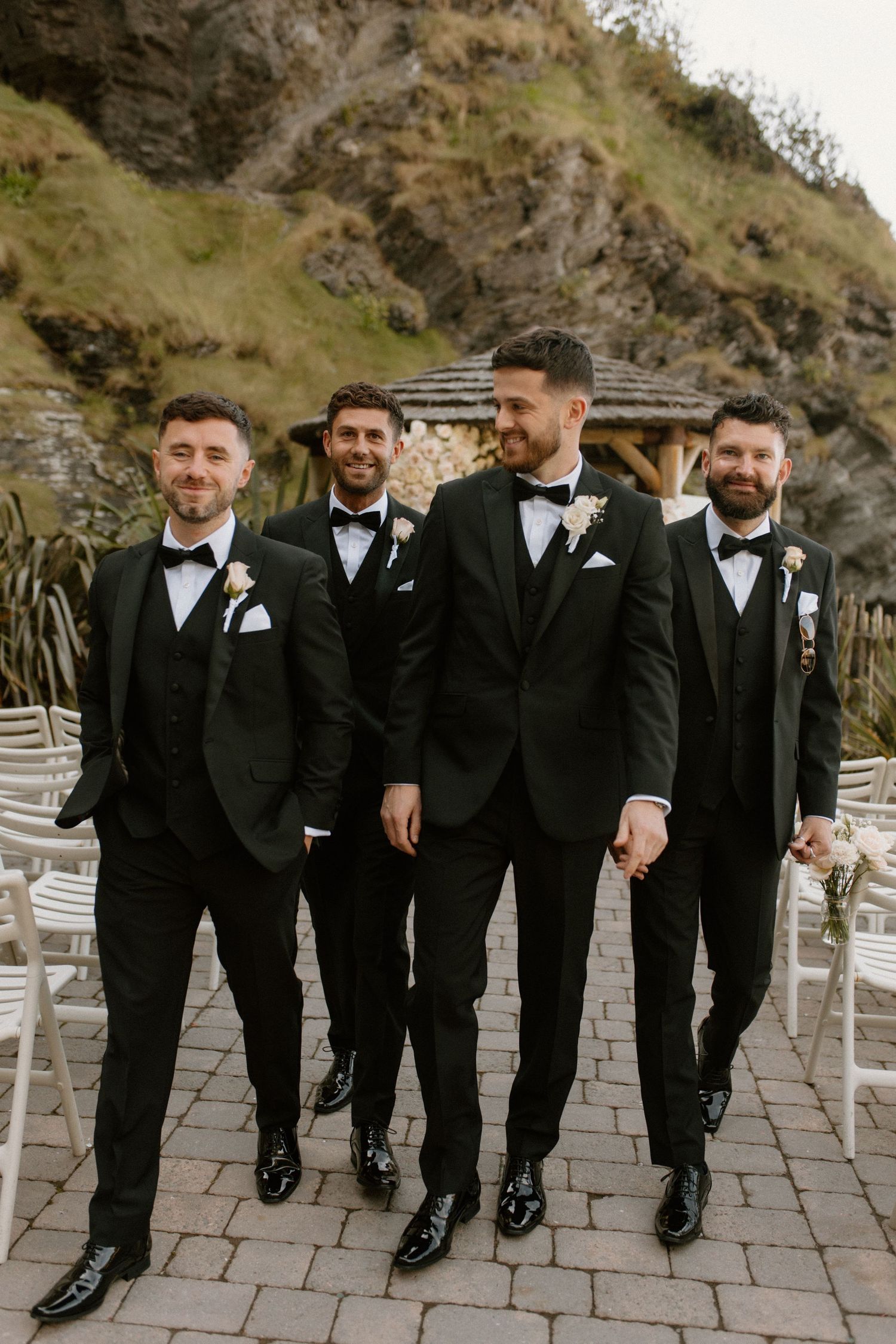 Groomsmen in tuxedos at luxury Devon beach wedding