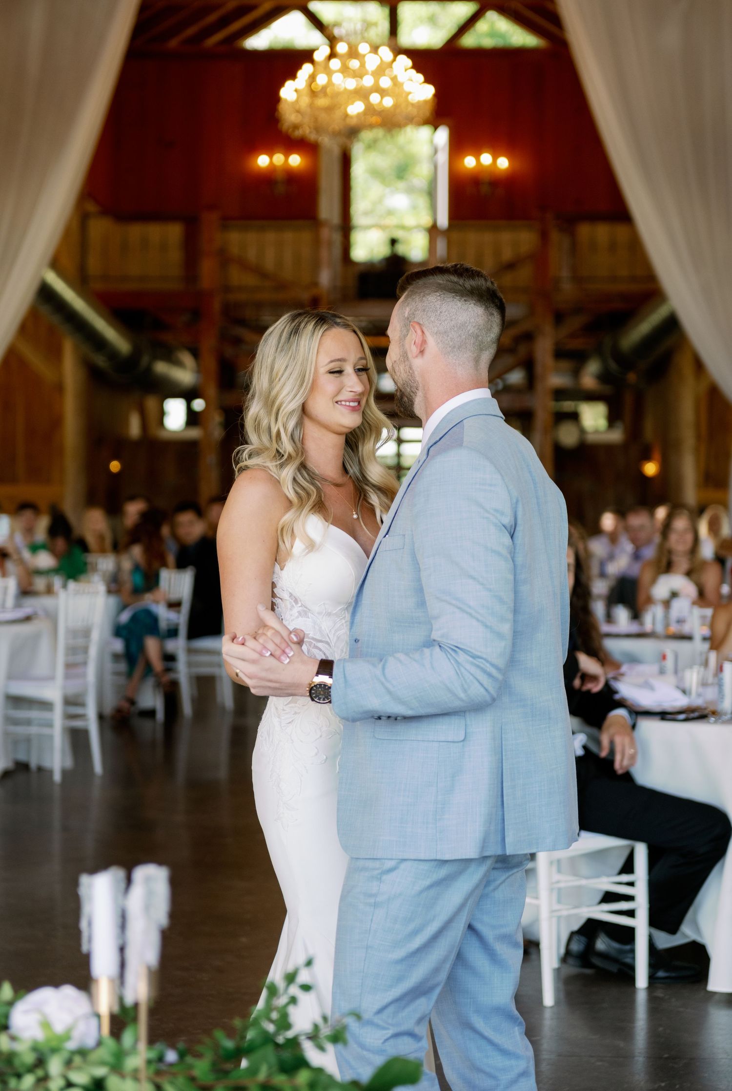 Bride and groom first dance in Jacksonville wedding venue Barn at Cottonwood Ranch.