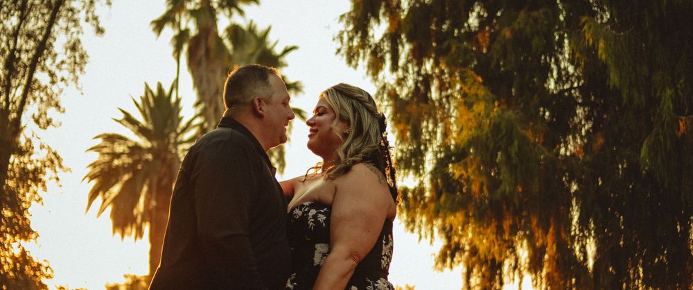 Cinematic couple dancing during sunset