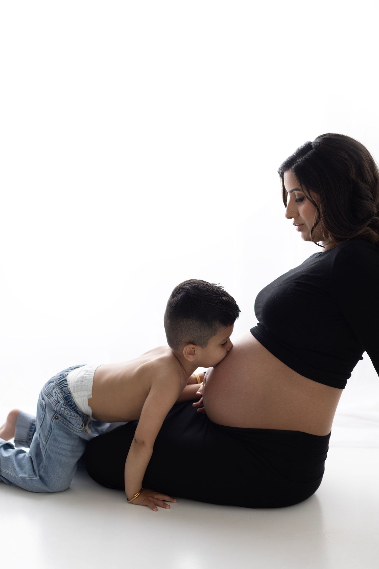 Gorgeous Rumneet awaits her new baby's arrival. Cloverdale. Surrey. Maternity Photography bump photos. Sleek black dress with cutout.