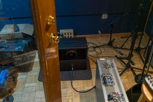 A Hama RF-200 remote cable release connected to a camera on a mounting plate with other equipment in view.