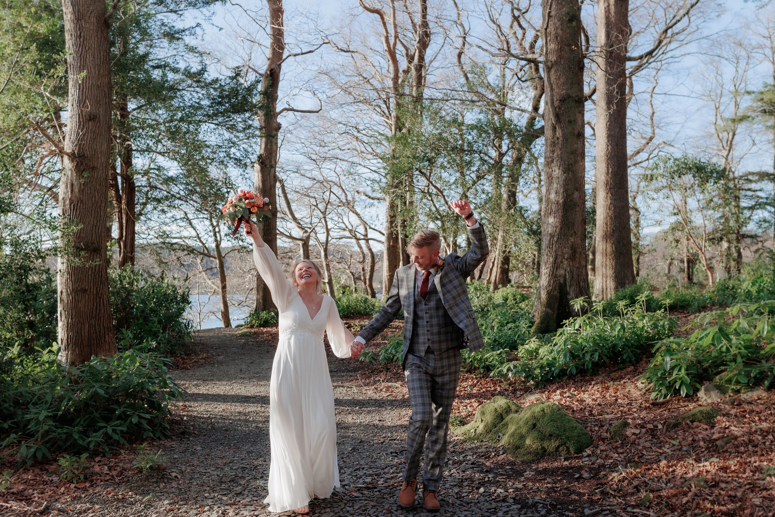 Wedding photography session in a wooded forest setting during winter.