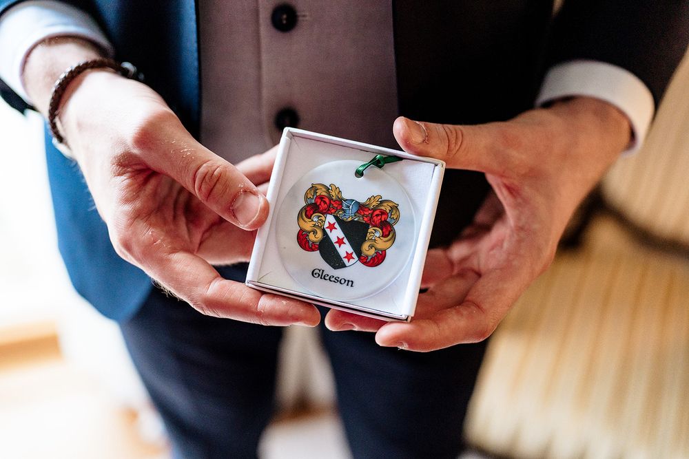 Someone holding a pack of Bicycle playing cards with butterfly designs on the back.