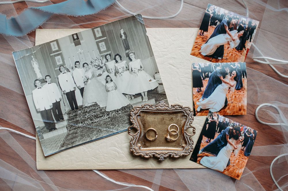 A vintage black and white photograph displayed alongside small orange-tinted modern photos and an antique decorative frame.