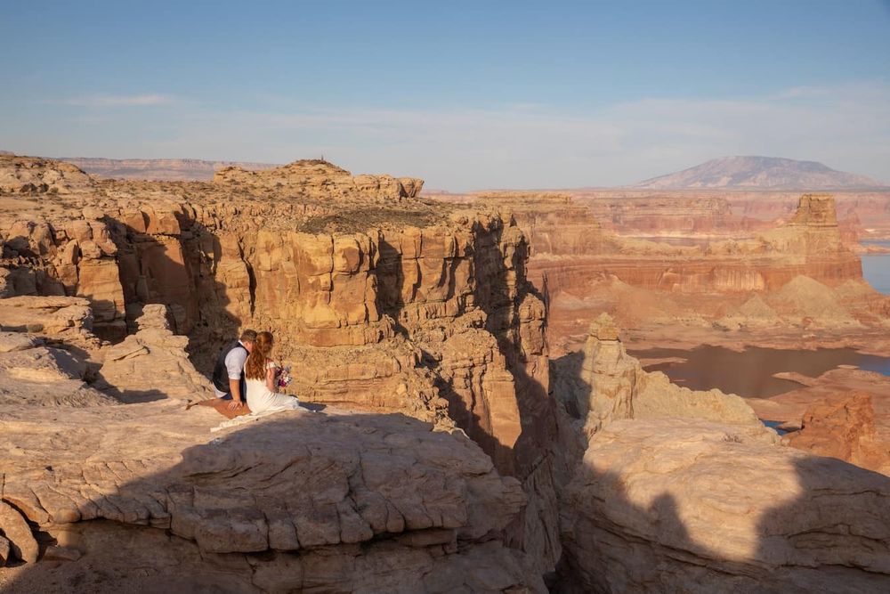 couple looking at each other at sunset over lake Powell