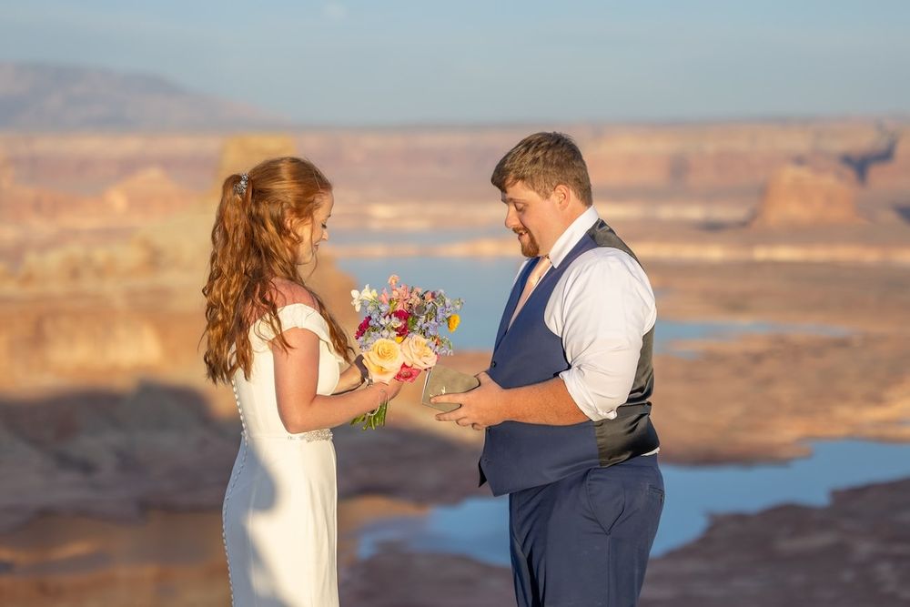 couple looking at each other at sunset over lake Powell
