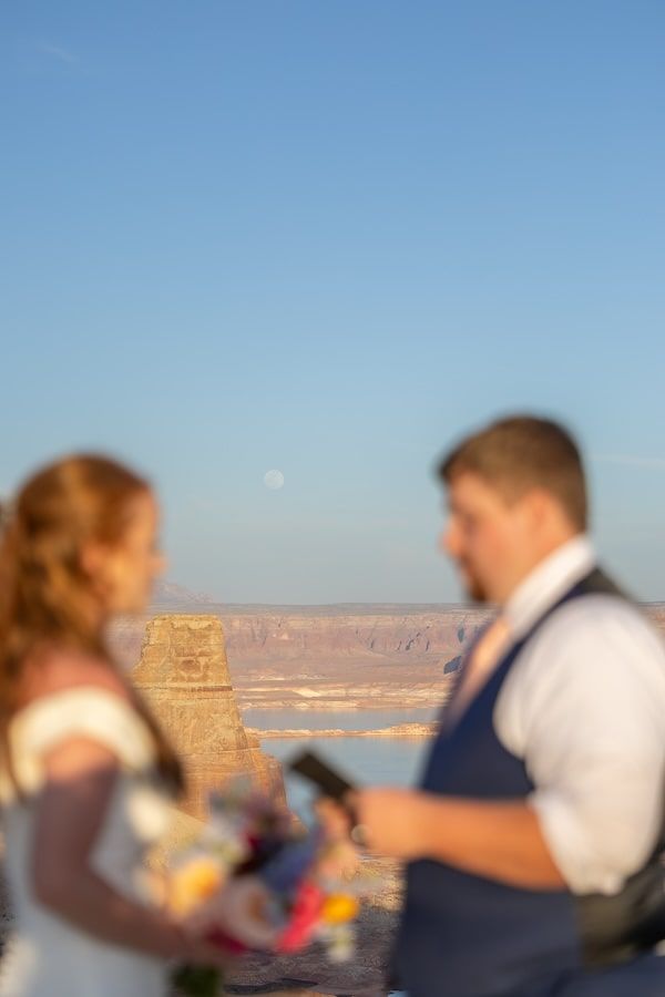 couple looking at each other at sunset over lake Powell