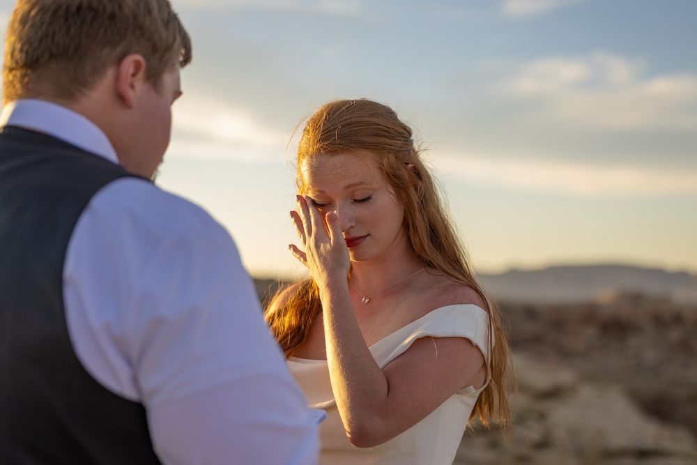 couple looking at each other at sunset over lake Powell