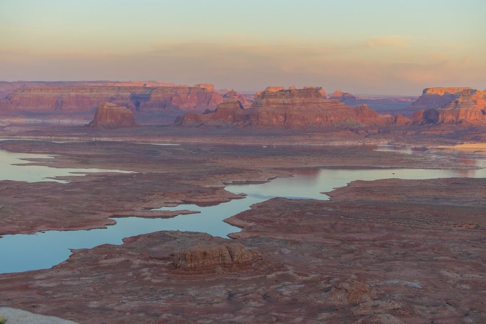 couple looking at each other at sunset over lake Powell