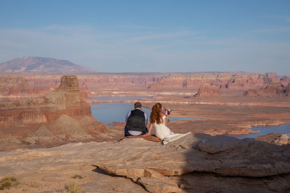 couple looking at each other at sunset over lake Powell