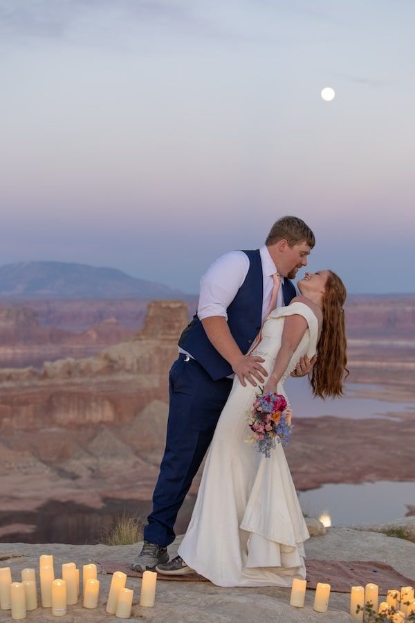 couple looking at each other at sunset over lake Powell