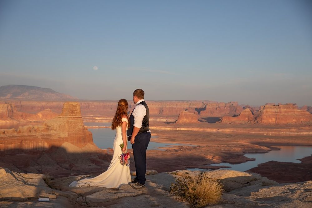 couple looking at each other at sunset over lake Powell