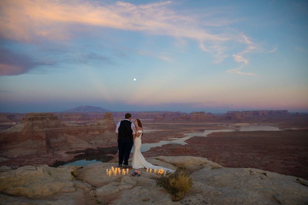 couple looking at each other at sunset over lake Powell
