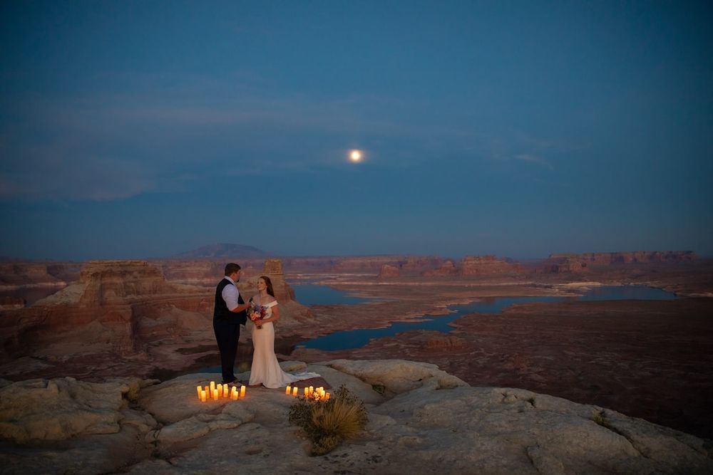 couple looking at each other at sunset over lake Powell
