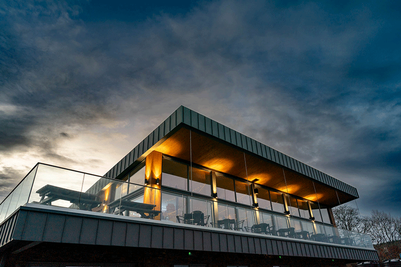 Exterior of The Holt Bar and Terrace lit up at night nr Budleigh Salterton-Devon