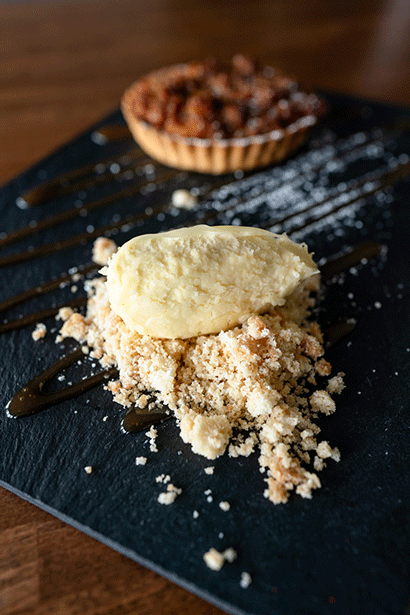 Desert placed on slate on dark wooden table