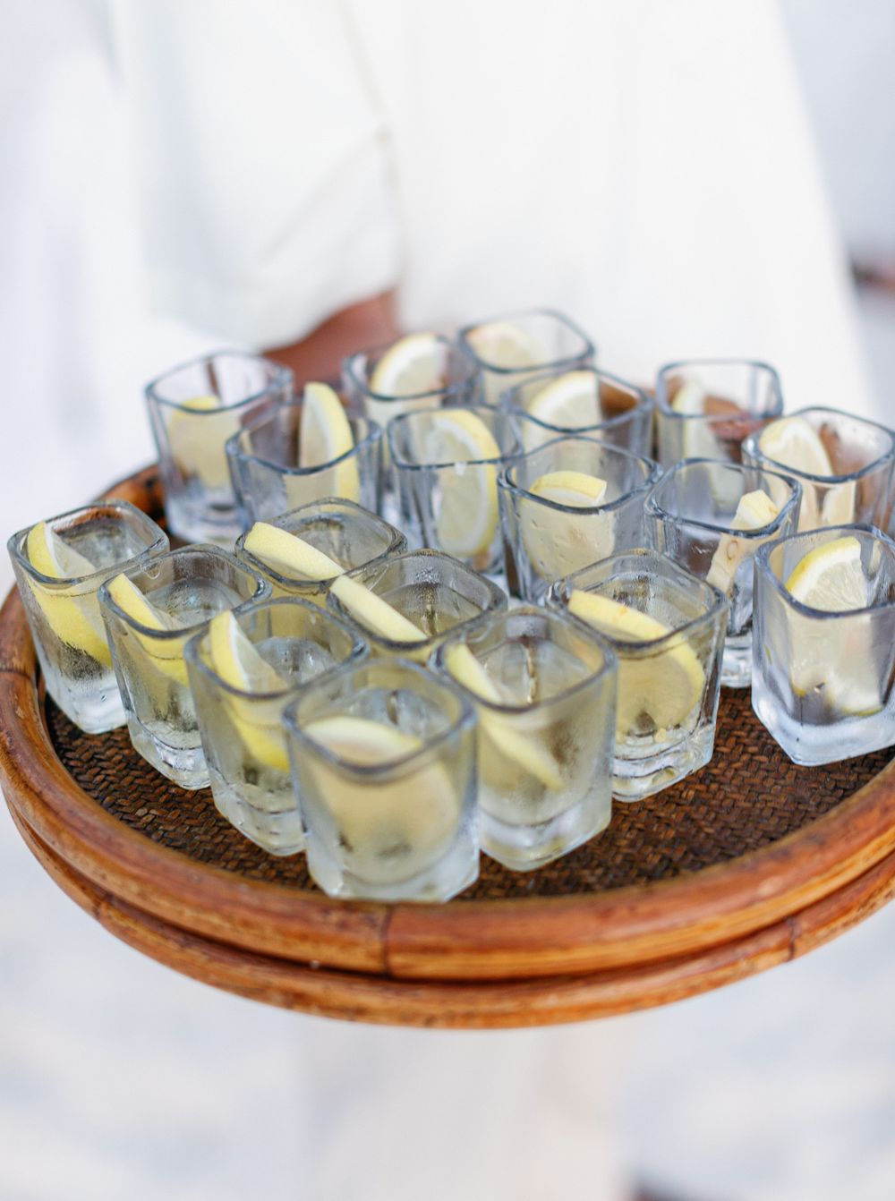 A tray of refreshing wedding cocktails at Amanpulo, Philippines - a delightful mix of flavors and colors.