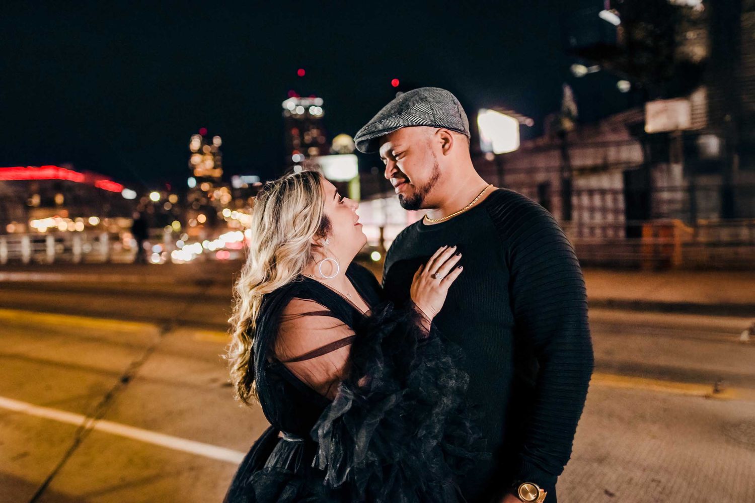 The bride and groom share a moment and stare into each other's eyes in front of Fenway Park during their Boston Engagement shoot.