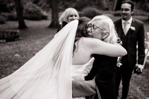 A bride and groom share intimate wedding day celebration moments outdoors in a black and white photo sequence.