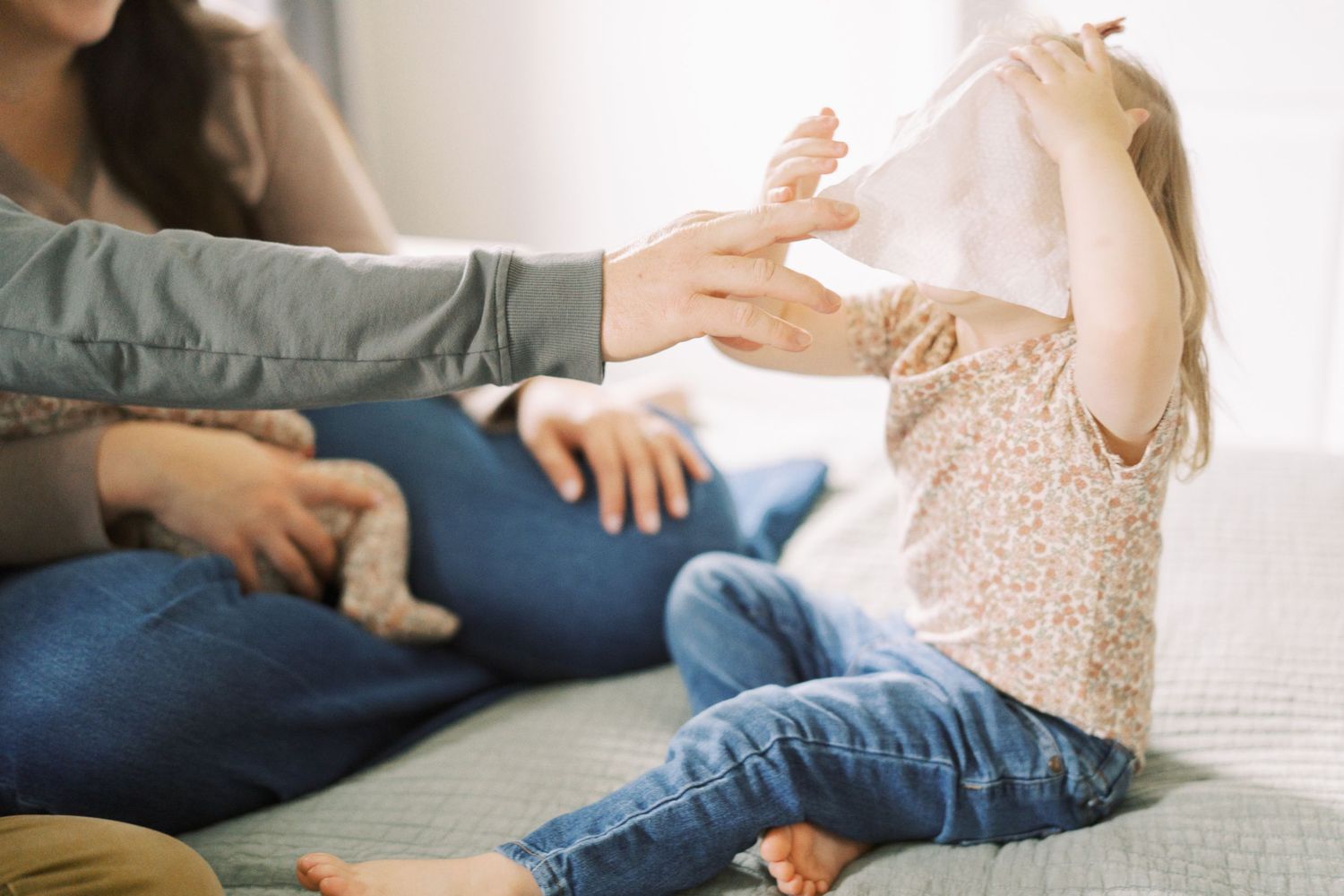 Connected sequence of photos showing a family bonding moment with their young child.